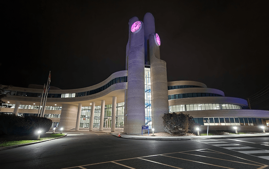 York Region Administration Building clock tower lit purple for LIght It Up! For NDEAM.